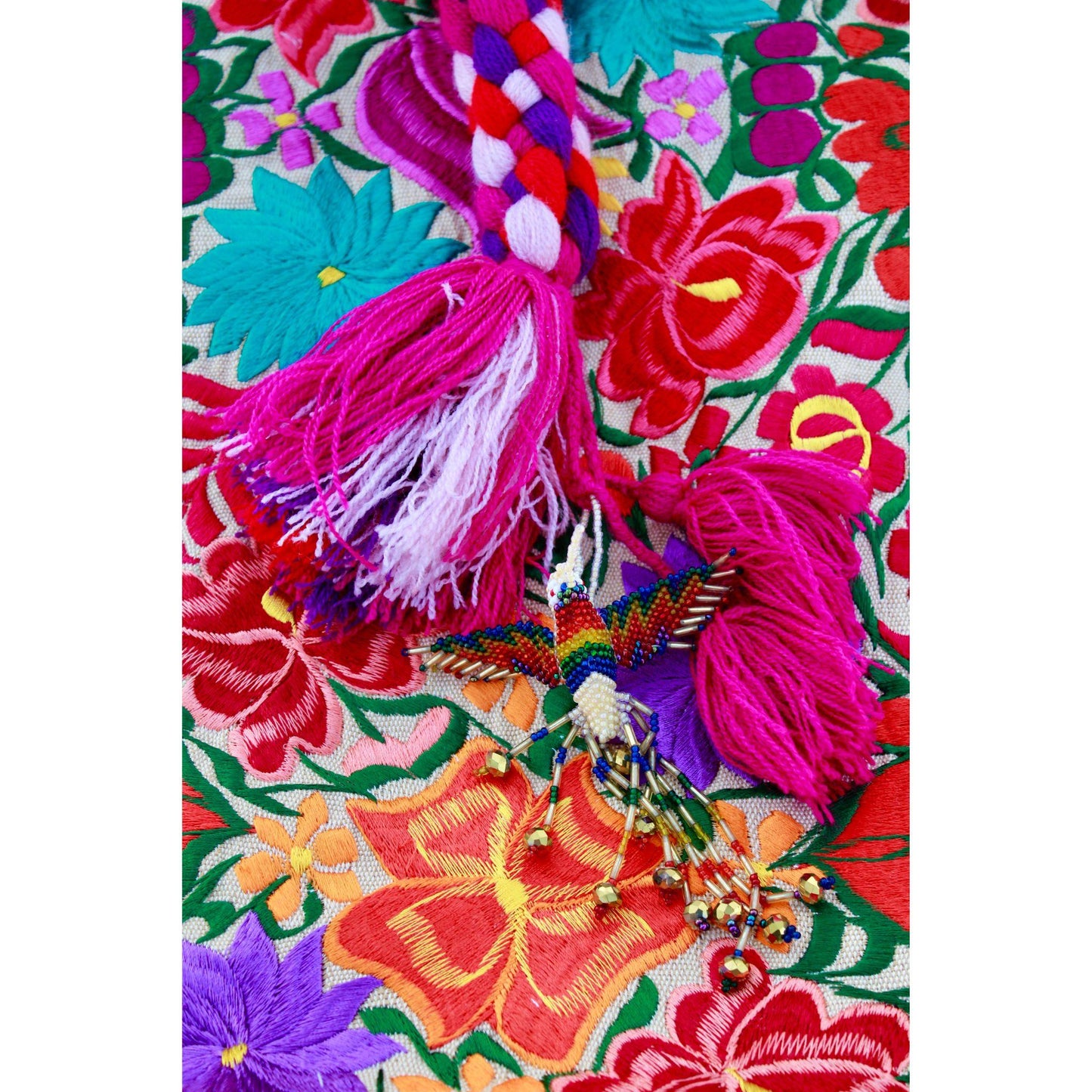 Red floral hat with tan bag